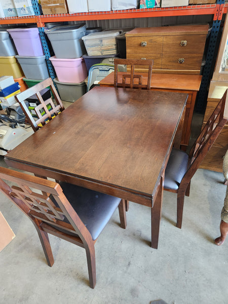 Dark wood table with 4 chairs